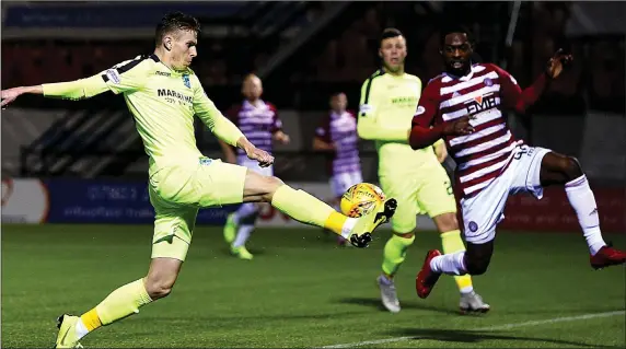  ??  ?? MAKING AN IMPACT: Oli Shaw gets on the end of a whipped Daryl Horgan delivery to knock the ball back across goal and beyond Marsden to earn Hibs three points