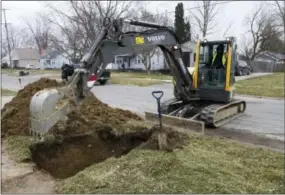  ?? THE ASSOCIATED PRESS ?? Work continues earlier this month on the water replacemen­t lines in Flint, Mich.