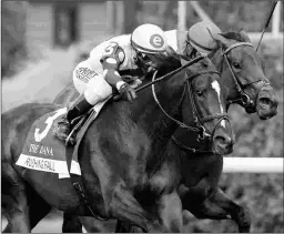  ?? BARBARA D. LIVINGSTON ?? Rushing Fall (left) is 4 for 5 at Keeneland, the Breeders’ Cup host track. Two of those wins came over yielding or soft turf.