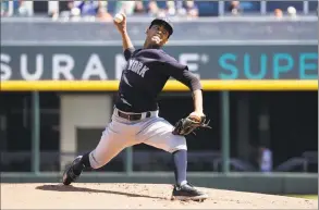  ?? John Bazemore / Associated Press ?? Yankees pitcher Deivi Garcia delivers against the Braves during a February spring training game.