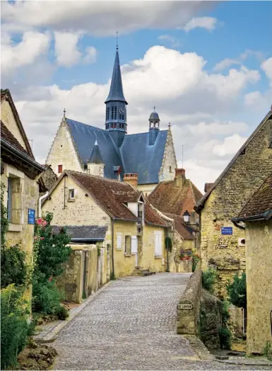  ??  ?? The narrow streets of Montrésor in the Loire Valley. Above right: Child with her daughter, Tuesday