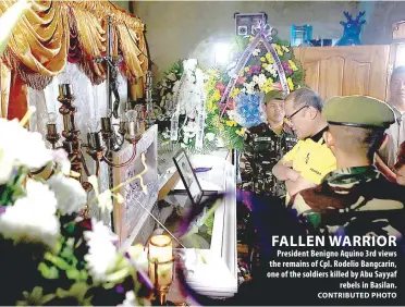  ?? CONTRIBUTE­D PHOTO ?? FALLEN WARRIOR President Benigno Aquino 3rd views the remains of Cpl. Rodelio Bangcarin, one of the soldiers killed by Abu Sayyaf rebels in Basilan.