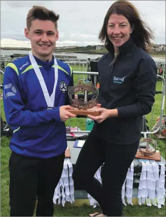  ??  ?? Jack McCullough is presented with the perpetual ‘crown’ as Under-18 champion in the H2O Northern Ireland Swim Series and (inset) heads for victory in the Senior Men’s race at the Belfast Titanic Swim.