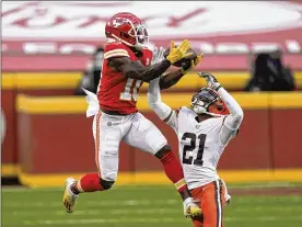  ?? ASSOCIATED PRESS ?? Chiefs wide receiver Tyreek Hill makes a catch over Browns cornerback Denzel Ward in the second half of Sunday’s playoff game in Kansas City. Ward says the Browns were prepared for the game and “have a lot to be proud of.”