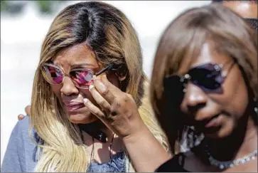  ?? Irfan Khan Los Angeles Times ?? LATISHA NIXON, left, mother of Gemmel Moore, and Joann Campbell, sister of Timothy Dean, at a 2019 news conference. Moore, 26, and Dean, 55, were Black men who died of overdoses in Buck’s apartment.