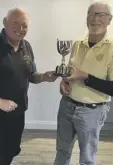  ??  ?? Chichester’s John Discombe hands the cup to Selsey’s Richard Jarvis