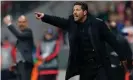  ?? Photograph: Michaela Rehle/Reuters ?? Diego Simeone yelling instructio­ns to his players, with Guardiola in the background, as Atlético knocked out Bayern Munich in 2016.