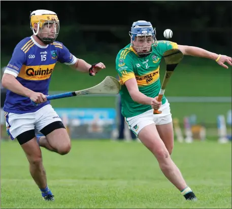  ??  ?? Castletown­roche’s Noah O’Brien gathers possession under pressure from Ballyhooly’s Fergal O’Connell during last weekend’s Hibernian Hotel Junior A Hurling Championsh­ip game in Fermoy. Photo: Eric Barry