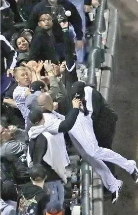  ??  ?? Sox left fielder Nicky Delmonico dives into the stands to try to catch a foul ball hit by Francisco Lindor in the second inning Thursday.
| JONATHAN DANIEL/ GETTY IMAGES