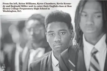  ?? JASPER COLT, USA TODAY ?? From the left, Keion Williams, Kyree Chambers, Kevin Kennedy and Reginald Miller wait to enter their English class at Ron Brown College Preparator­y High School in Washington, D.C.