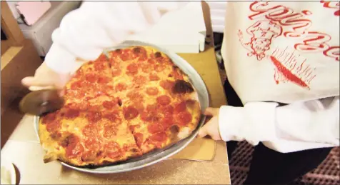  ?? Christian Abraham / Hearst Connecticu­t Media ?? During COVID- 19 restaurant shutdowns, Zuppardi's Apizza in West Haven and Derby offered “pizza at home” kits with dough, cheese, sauce and toppings.