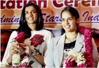  ?? PTI ?? PV Sindhu and Saina Nehwal felicitate­d for their performanc­e at World Badminton Championsh­ips in Glasgow. —