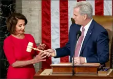  ?? Carolyn Kaster/Associated Press ?? Ms. Pelosi receives the gavel from House Minority Leader Kevin McCarthy, R-Calif., on Thursday after being elected House speaker.