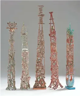  ?? RICH MACIEJEWSK­I ?? Right: Eugene Von Bruenchenh­ein concocted these bone towers from poultry bones, paint, glue, egg shells and other materials.