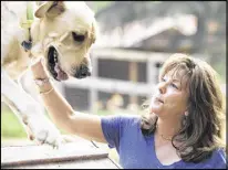  ?? RHYM / AJC CHAD ?? Susie Aga, founder of Atlanta Dog Trainer, said, “These days everybody’s saying their dog is an emotional support dog ... It’s being very abused.”