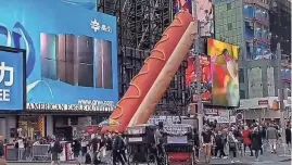  ?? PROVIDED BY STORYFUL ?? A 65-foot long hot dog art installati­on arrives in Times Square.