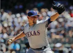  ?? Associated Press ?? Texas Rangers' Austin Bibens-Dirkx delivers a pitch during the first inning of a baseball game Saturday against the New York Yankees in New York.