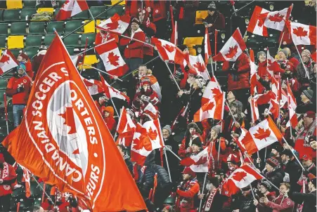  ?? LARRY WONG ?? Team Canada fans cheer on their team during a FIFA 2022 World Cup qualifier match against Costa Rica in Edmonton.