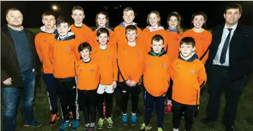  ??  ?? West Muskerry AC runners with two of the five sponsors: (left) John Roche of Macroom Opticians and (right) Cormac Deasy of Deasys Pharmacy who sponsored running tops and gear bags for the 14 athletes who competed at the All Ireland Cross Country...