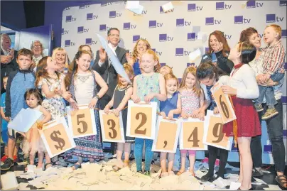  ?? KATIE SMITH/THE GUARDIAN ?? Islanders celebrate at the Eastlink studio in Stratford Sunday evening following the 22nd annual Queen Elizabeth Hospital/Eastlink Telethon as it was announced that $532,496 was raised in just 18 hours.