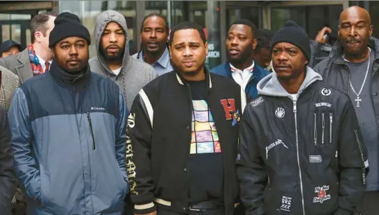  ?? JOSE M. OSORIO/CHICAGO TRIBUNE ?? The Cook County state’s attorney’s office dismissed charges against 15 men, including some shown here as they stand outside the Leighton Criminal Court Building on Nov. 16, 2017, in Chicago. The men said they were framed by disgraced Sgt. Ronald Watts.