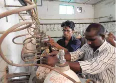  ?? — AFP ?? Workers examine oxygen cylinders at the Baba Raghav Das Hospital in Gorakhpur on Saturday.