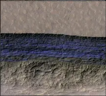  ??  ?? Undergroun­d ice exposed at one of Mars’s steep slopes appears here as a bright blue band