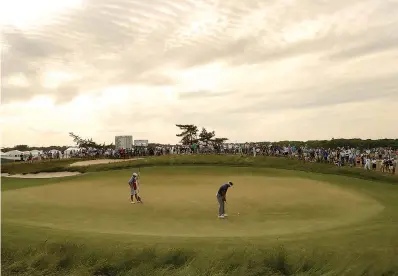  ?? AP Photo/Julio Cortez ?? ■ Ian Poulter, of England, putts on the 14th green during the third round of the U.S. Open Golf Championsh­ip on Saturday in Southampto­n, N.Y.