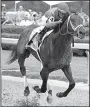  ?? The Sentinel-Record/ RICHARD RASMUSSEN ?? Luis Saez guides Magnum Moon across the wire to win the Rebel Stakes on Saturday at Oaklawn Park in Hot Springs. Magnum Moon won by 31/2 lengths over Solominni in 1 minute, 42.68 seconds.