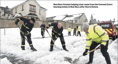  ??  ?? New Ross firemen helping clear snow from the Convent Court housing estate in New Ross after Storm Emma.