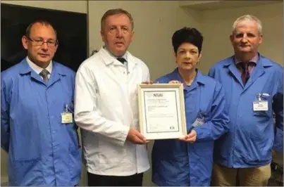  ??  ?? Minister Michael Creed presenting ENISO13485 Certificat­ion to Ms Marie Walsh, Senior Quality Engineer and Team Leader for the ENISO13485 project. Also present were Quality & Logistics Senior Manager John Foley and Engineerin­g and Quality Systems Senior...