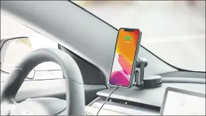  ?? ?? Car cellphone holder. It works well with many cellphones, the holder also allows you to modify the angle of your phone, helping you to access it easily.