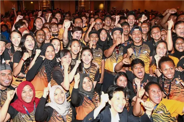  ??  ?? In high spirits: Chef de mission Marina Chin and Olympic Council of Malaysia secretary general Datuk Low Beng Choo (front in jacket) with national athletes at the start of the one-week centralise­d camp at a hotel in Kuala Lumpur yesterday. — AZLINA...