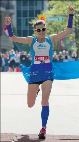  ??  ?? Women’s winner Ellie Greenwood crosses the finish line. Greenwood moved to Vancouver just over a week ago.