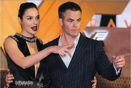  ?? REBECCA BLACKWELL/THE ASSOCIATED PRESS ?? Actor Chris Pine, right, has nothing but praise for his Wonder Woman co-star Gal Gadot, left. “That softness and beauty and strength to me is the critical combinatio­n, and Gal has it in spades,” Pine says.