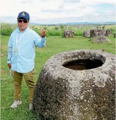  ??  ?? Innovative Travel guide Fhan at the Plain of Jars in Xieng Khouang province.