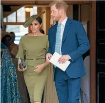  ??  ?? Meghan kept things simple with an olive green ensemble at Prince Louis’ christenin­g.