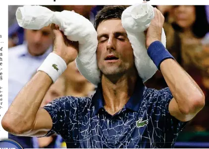  ?? AP ?? Blinding heat: Djokovic uses an ice towel during his win against Millman