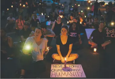  ?? Hyoung Chang, The Denver Post ?? About 2,000 people gathered at a protest of the federal Immigratio­n and Customs Enforcemen­t on Friday night at an ICE detention facility in Aurora. The protest included a candleligh­t vigil.