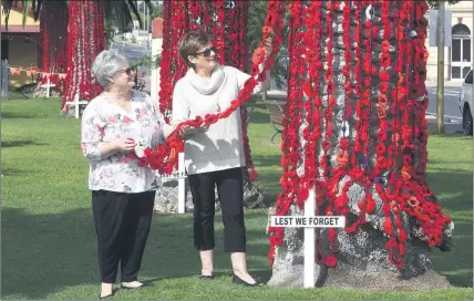  ?? Picture: PAUL CARRACHER ?? PEOPLE POWER: Project organisers Rosie Clark, left, and Pam Deckert appreciate the work and donations of thousands of volunteers across Australia in the creation of a poppy tribute at Nhill’s Goldsworth­y Park.