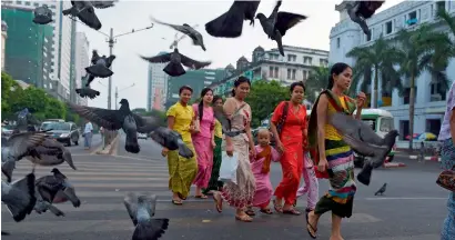  ?? AFP ?? Devotees approach the entrance of sule pagoda in Yangon. Myanmar has undergone a stunning political transforma­tion in recent years, blossoming from isolation under the junta to become an increasing­ly vibrant nation. —