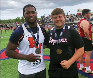  ?? ANDREW HELLER - MEDIANEWS GROUP ?? Perkiomen Valley senior Ronde Washington, left, and Boyertown senior Jayden Miller pose with their PIAA medals after their podium finishes in the shot put at the PIAA Track and Field Championsh­ips Friday at Shippensbu­rg University.