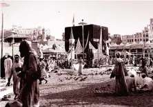  ?? AP ?? Muslims visit the Kaaba during a pilgrimage to Makkah in 1954.