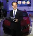  ?? JOSE JUAREZ/THE ASSOCIATED PRESS ?? Honda executive Henio Arcangeli Jr. with the 2018 Accord, which won as American Car of the Year.