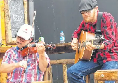  ?? SUBMITTED PHOTO ?? Dwayne Côté and Jason MacDonald performed recently on Governor’s street-level deck in downtown Sydney.