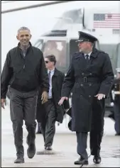  ?? CAROLYN KASTER/THE ASSOCIATED PRESS ?? President Barack Obama walks Saturday from Marine One to board Air Force One at Andrews Air Force Base, Md., en route to a stopover in Anchorage, Alaska, before flying on to Vietnam and Japan.