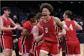  ?? KEITH BIRMINGHAM – STAFF PHOTOGRAPH­ER ?? Harvard-Westlake's Trent Perry celebrates with teammates after defeating St. Joseph 76-65 to win the CIF State Open Division championsh­ip Saturday night in Sacramento.