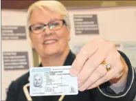  ?? MILLICENT MCKAY/JOURNAL PIONEER ?? Paula Biggar, minister of Transporta­tion, with her draft of the new provincial drivers’ licence.