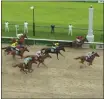  ?? NBC SPORTS VIA AP ?? Secretaria­t, right, crosses the finish line to win a computersi­mulated version of the Kentucky Derby horse race between the 13 winners of the Triple Crown, Saturday in Louisville, Ky.