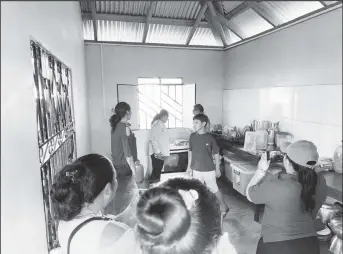  ?? ?? Minister of Amerindian Affairs Pauline Sukhai touring one of the completed projects with others. (Ministry of Amerindian Affairs photo)